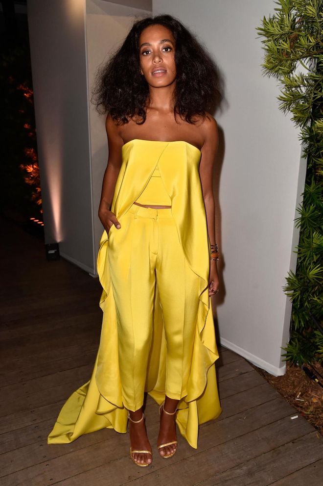 With sun-soaked skin and brushed curls, Solange stood out in this canary silk two-piece during Art Basel Miami Beach