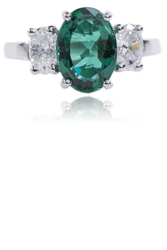 Three stone emerald ring with diamonds, $38,000, greenwichjewelers.com.
