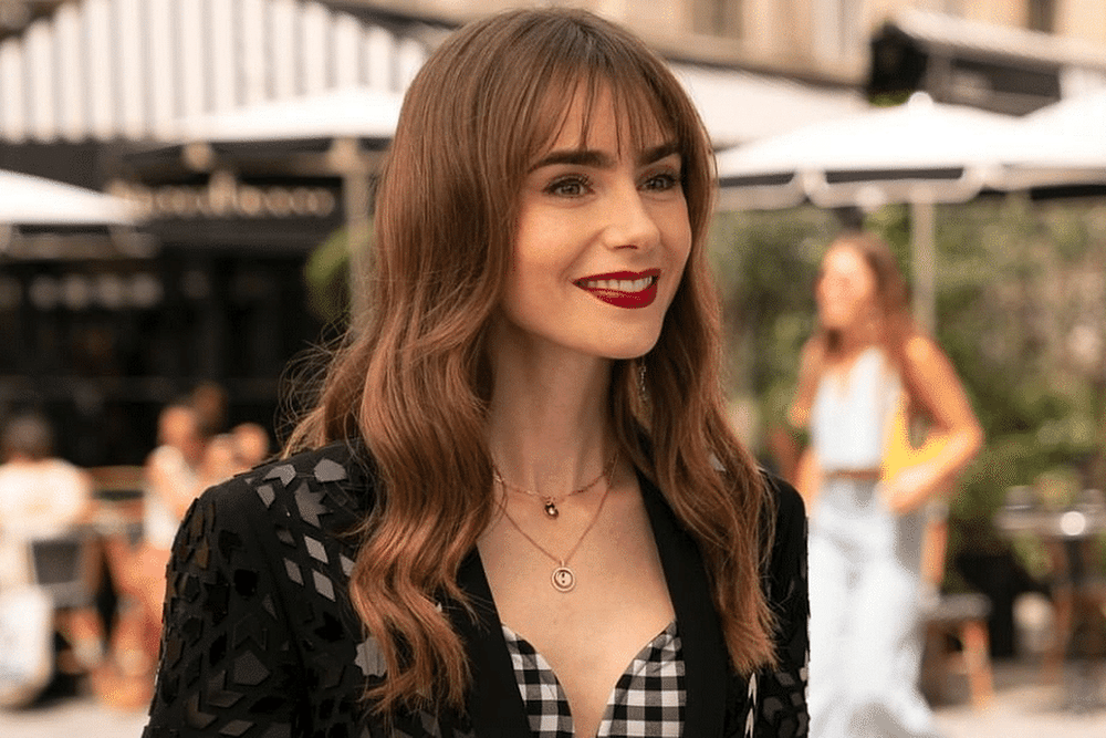 Lily Collins Is A Parisian It Girl In An Elegant Gown Covered In Cutouts