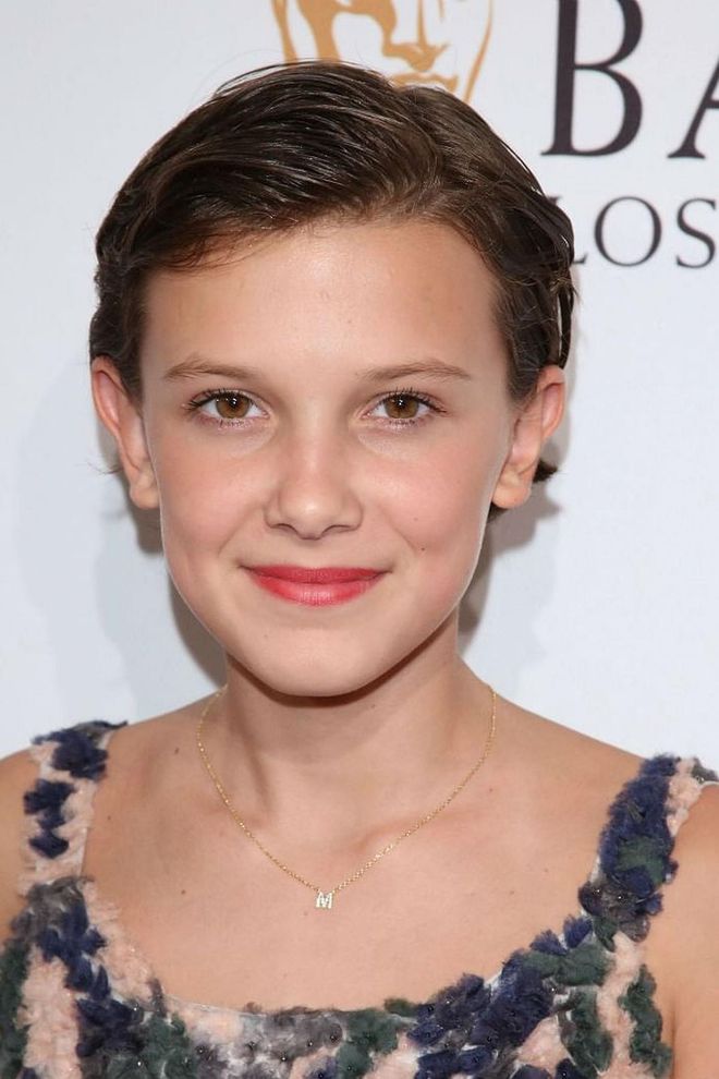 What's it like being such a cool, happening teen? Here, Millie Bobby Brown shows us a sophisticated way to style a cropped cut: slicked back and tucked behind the ears.  Photo: Getty