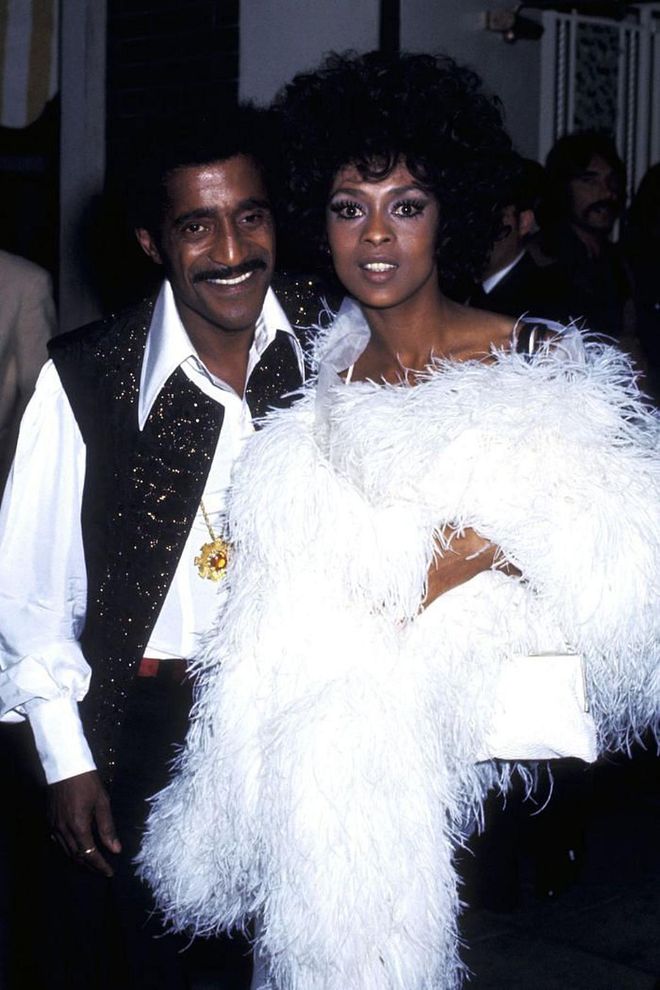 Lola Falana sure knew how to accessorize—a feather boa was the perfect touch to add a little drama to a classic black gown.