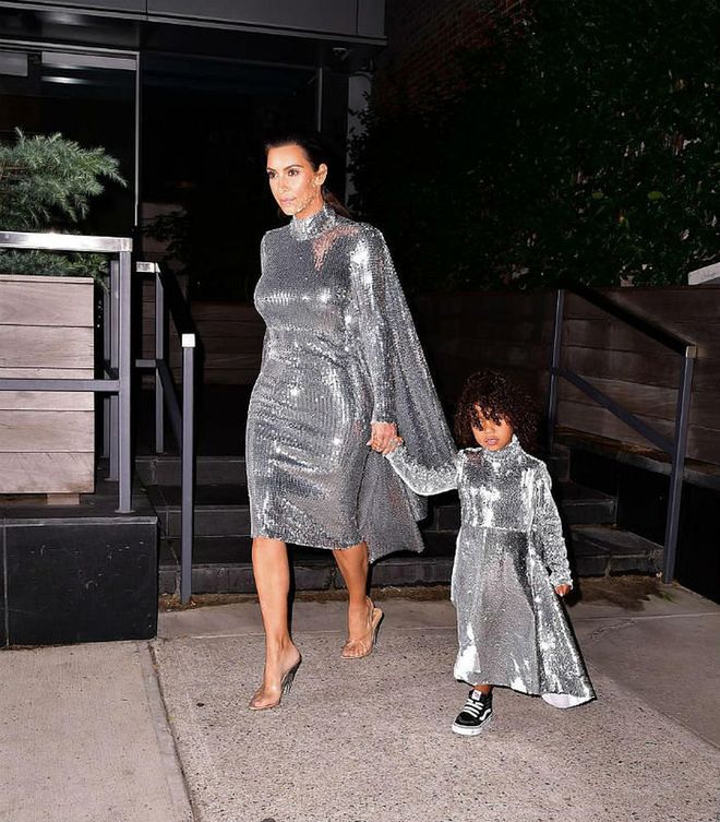 North West often takes style hues from her famous mom (or vice versa), but the duo outdid themselves when they wore these matching silver sequin Vetements dresses to attend one of Kanye West's concerts. While Kim topped hers off in clear PVC heels, North dressed the look down a bit with her classic black Vans. Photo: Getty