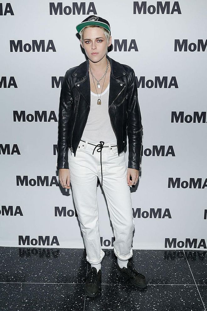 The Twilight movie actress showed up at the Moma event looking edgier than ever in a black leather jacket over her white outfit. Photo: Getty