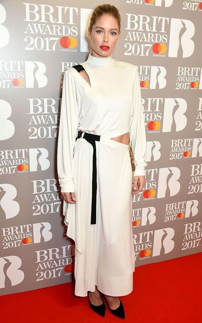 Doutzen Kroes wore a draped white dress with cut-outs. Photo: Getty 