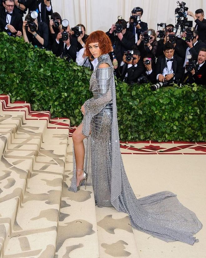 Zendaya won us over as a modern, sophisticated version of Joan of Arc at this year’s Met Gala: Heavenly Bodies. Zendaya perfectly channeled the military figure — who was canonized as a Roman Catholic saint in the 15th Century — and was ready for battle in “armour” of tiny studs and sequins, and stylized with neck and shoulder plates. It was all curated by Versace, and all fabulous on this girl. Photo: Shutterstock