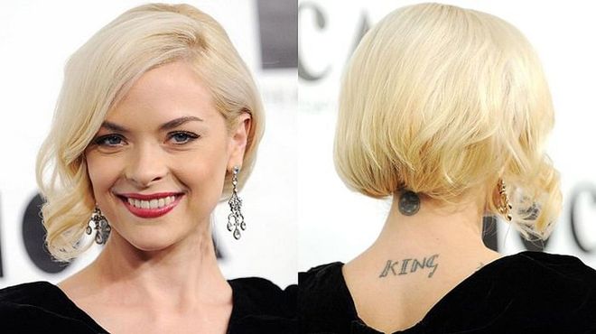In addition to her last name and the two stars on her back and neck, King also has "Jesus" and a spade tattooed on the inside of her right hand and wrist, respectively.