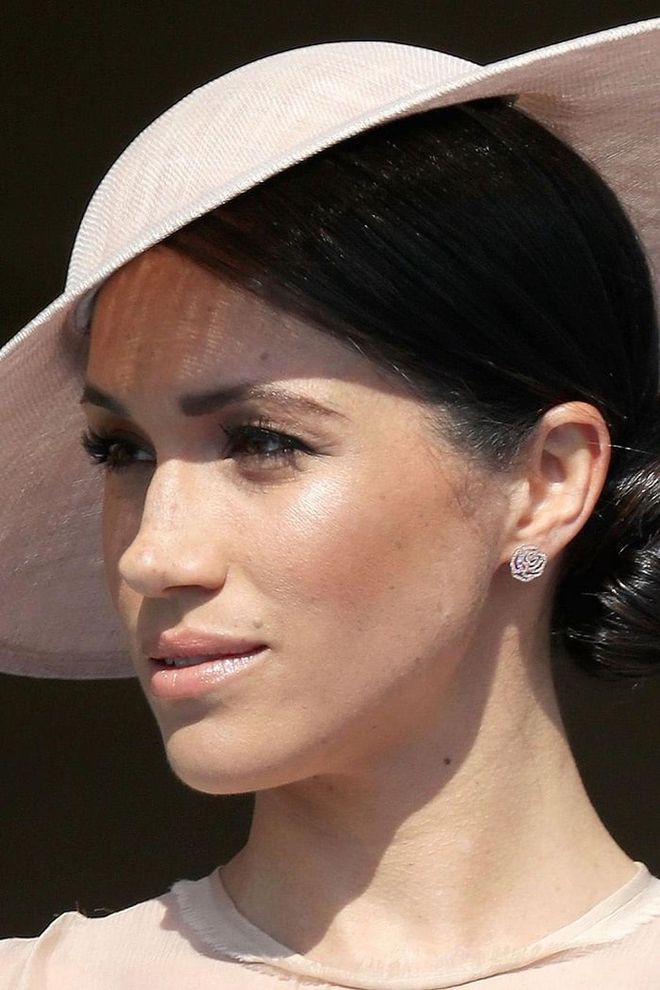 For her first appearance as a Duchess at Prince Charles' birthday celebration, Meghan wore Vanessa Tugendhaft's Idylle La Rose Earrings. The 18-karat pavé diamond studs sold out 10 minutes later, according to the designer, with the matching bracelet and necklace disappearing not long afterward. She'd previously worn the brand's Infini ring and Precious Charm necklace, but it's official: Her new royal status comes with some serious style power. Photo: Getty