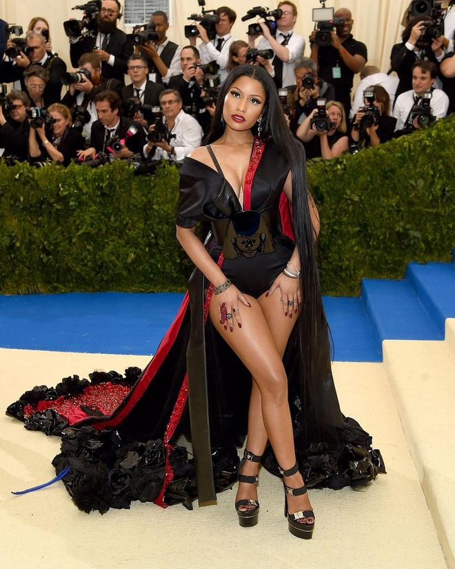 Nicki Minaj was serving vampire queen realness with this black and red corseted cape. Photo: Getty 
