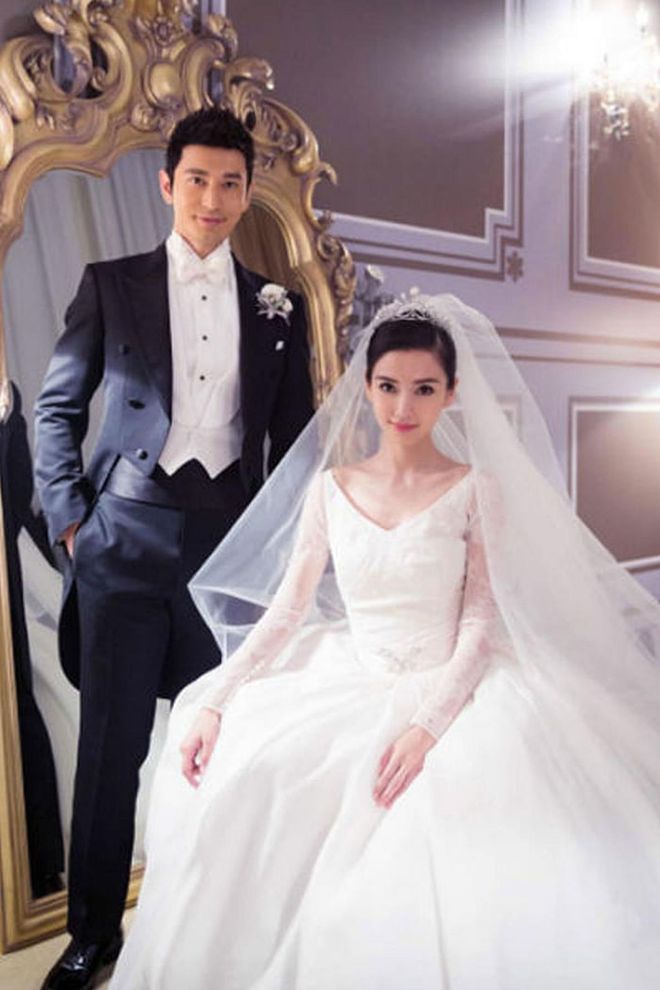 While the exact cost of Chinese superstar Angelababy's bridal gown isn't public, the fact that her wedding to actor Huang Xiaoming came out to a remarkable $31 million makes it pretty safe to assume the pair spent a pretty penny on the dress. After all, her custom Dior design reportedly took five months to create and featured several dozen Chantilly lace rose bouquets, as well as an extravagant 10-foot train.