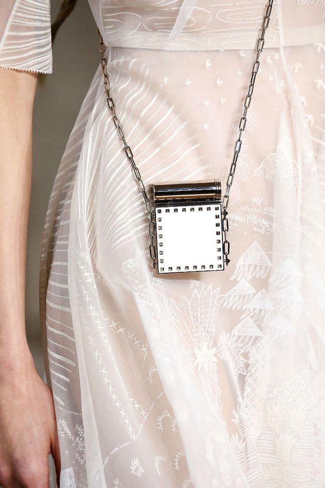 Seen at: Paris Fashion Week//Why we love it: Whether or not this bag functions more than just an accessory, you can't deny that this adorable number from Valentino is just as cute as a button. (Photo: Getty)
