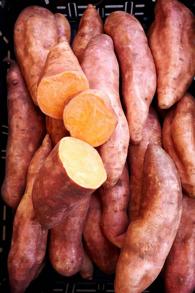 Keep a couple of these orange root vegetables in your pantry for when you want to satisfy your carb craving and sweet tooth. A medium-sized sweet potato contains about 27 grams of carbs, but they've been shown to increase levels of adiponectin, a hormone that regulates blood sugar and helps to encourage a faster metabolism. They're also fat-free and have fewer calories and sodium than white potatoes.