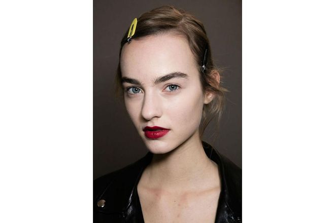However, Peter Philips, Dior's creative director for make-up, mixed it up by giving a few of the models a striking red lip. Philips took inspiration from Christian Dior's tradition of sending a model in a red dress down the catwalk halfway through the show to brighten it up ; Photo: Getty