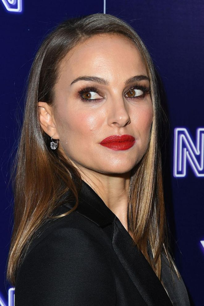Christmas calls for breaking the 'eyes or lips' rule and the prettiest pairing is chocolate brown and rich red. To make like Natalie Portman, arm yourself with the Charlotte Tilbury Luxury Palette in The Sophisticate with the Rouge Dior Ultra Care in 999 Bloom. Photo: Getty