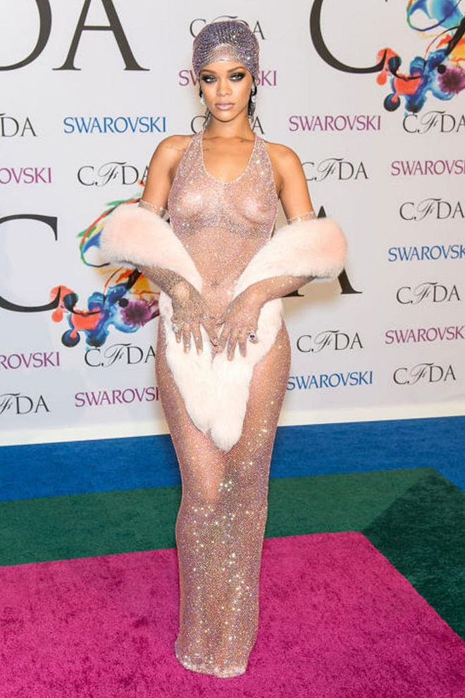 Recipient of the Fashion Icon Award, Rihanna attended the 2014 CFDA Fashion Awards in a stunning light pink Swarovski crystal naked dress, made all the more glamorous with a fur shawl and matching sequined headscarf. Photo: Getty
