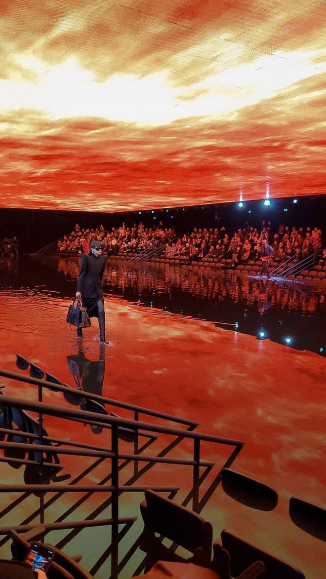 Balenciaga's post-apocalyptic set recreated a sports stadium half submerged in water.