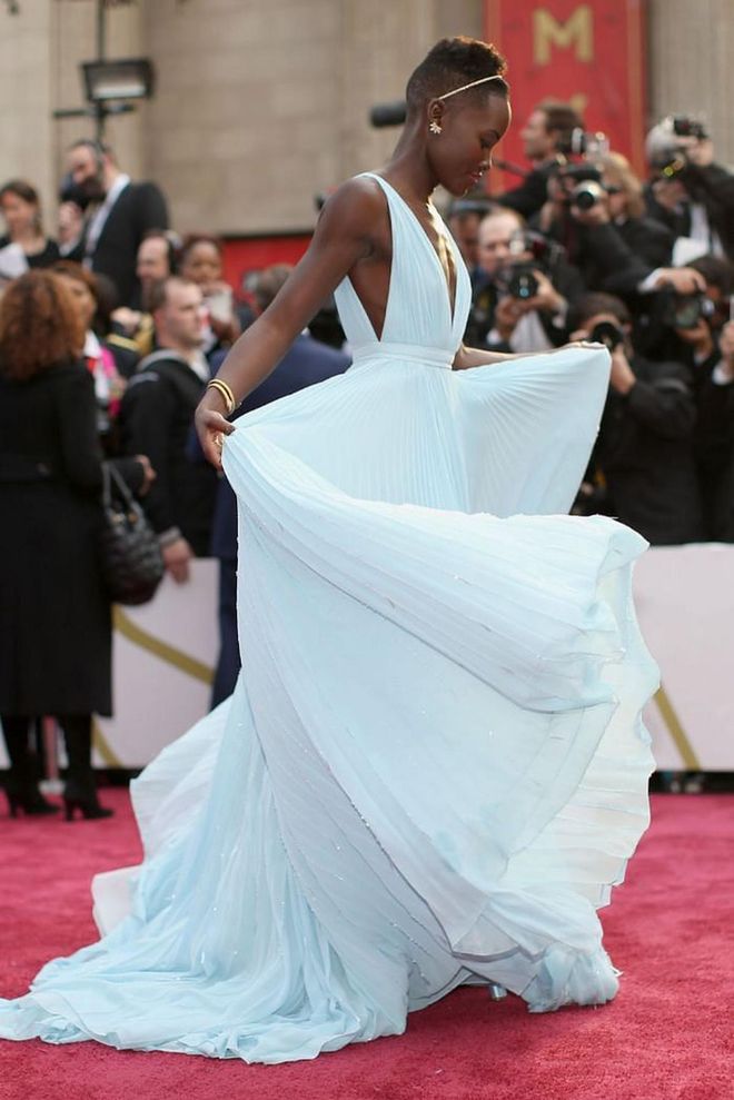 2014 was a huge year for Lupita Nyong'o, who took home the Oscar for Best Supporting Actress thanks to her role in 12 Years A Slave. For the occasion, the actress wore the most elegant blue Prada pleated gown, which she playfully twirled in on the red carpet, and immediately had her topping best-dressed lists the world over.

Photo: Getty