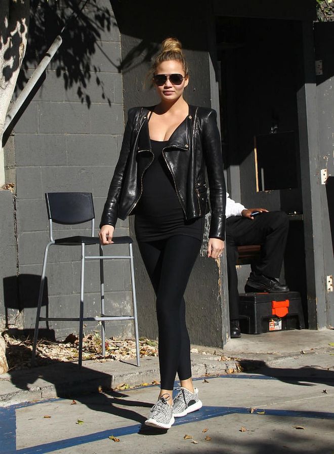 Atheleisure chic meets rebel rouser when Chrissy boldly matches her gym gear with a leather biker jacket. Photo: Getty