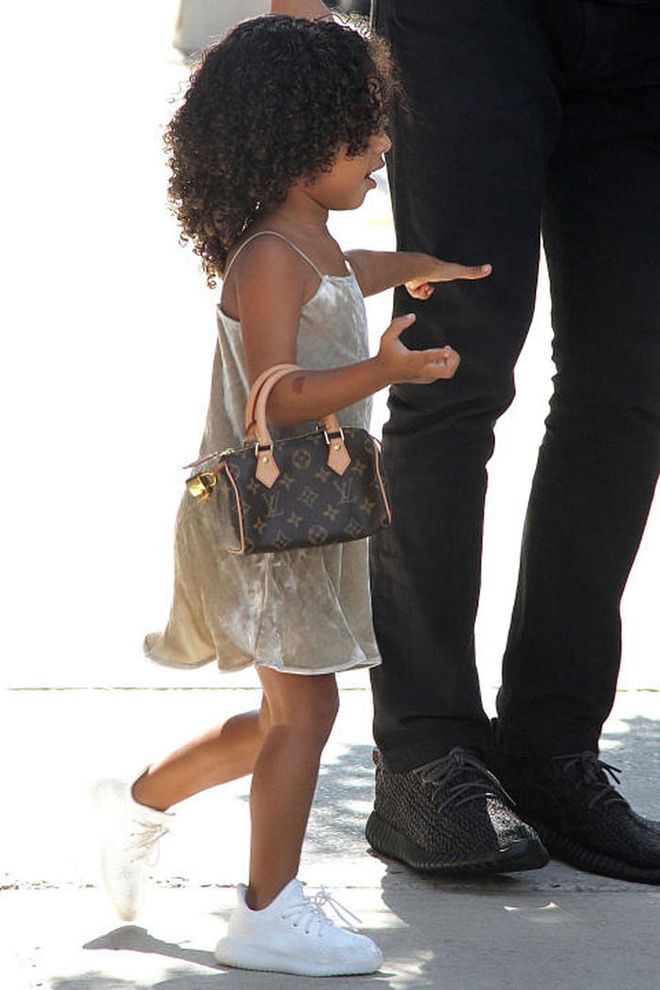 If anyone can bring back the monogram Louis Vuitton Speedy bag, it's 3-year-old North West. The tot was spotted in New York carrying a mini version of the bag and wearing one of her signature slip dresses with a pair of white sneakers. Take note, street style stars. Photo: AKM-GSI