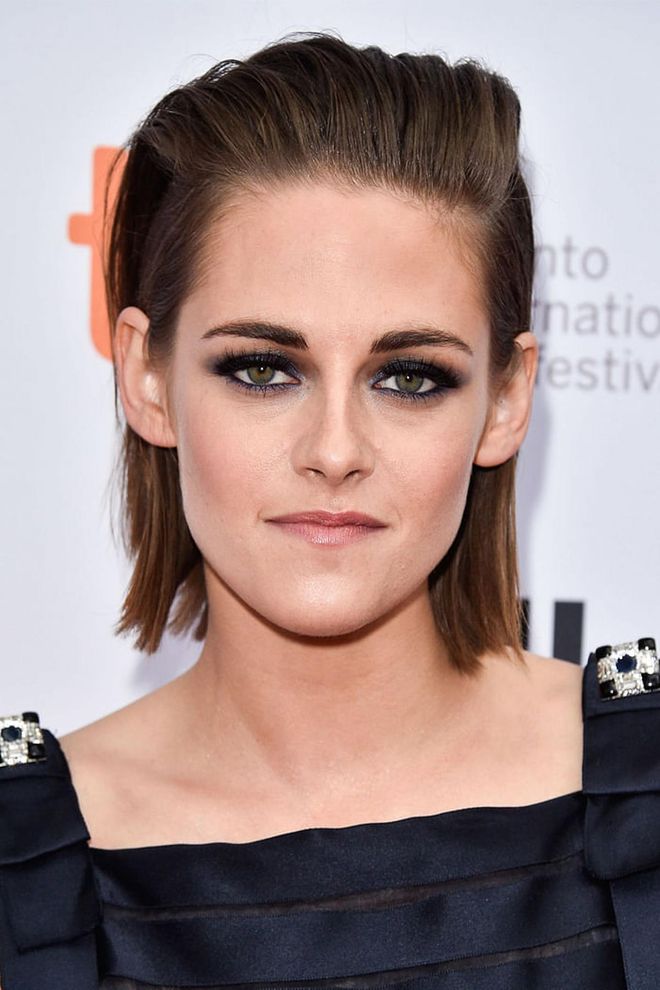 Stewart's the ultimate hair and beauty chameleon, and we're kind of in love with this completely slicked-back—but not greasy—straight-ironed style. 
