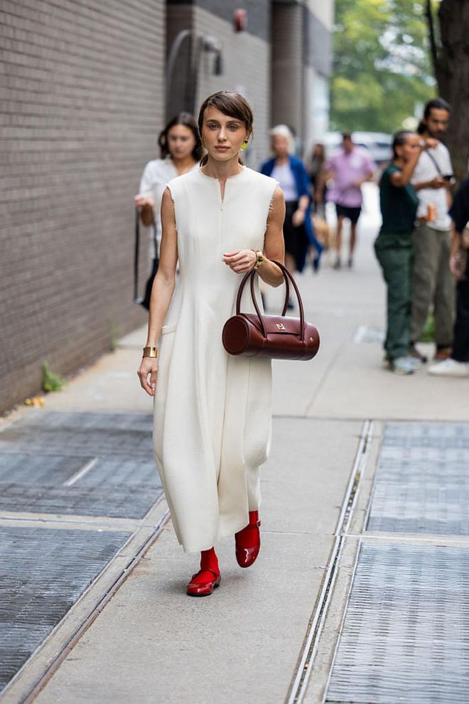 NEW YORK, NEW YORK - SEPTEMBER 09: Mary Leest wears creme white dress, burgundy bag outside Tibi on September 09, 2023 in New York City. (Photo by Christian Vierig/Getty Images)