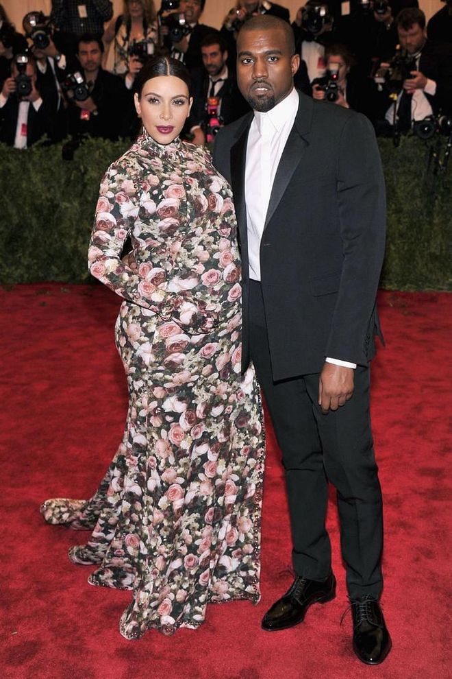 Kim Kardashian recently revealed that she "cried all the way home" after the response she received over this Met Gala look. At the time, the now mother-of-four was heavily pregnant with her first child North, and housed her bump underneath a floral high-neck, long-sleeved gown with a thigh-high split by Riccardo Tisci for Givenchy. Now, looking back, the reality TV star couldn't be happier with the look: "Now I love it, now it's sick," she said.

Photo: Getty