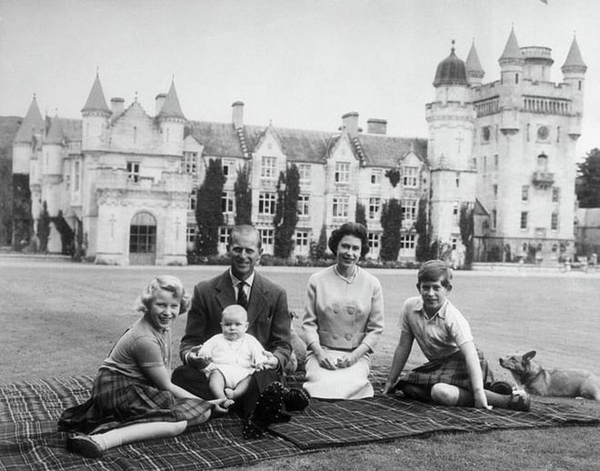 Prince Philip and Queen Elizabeth have a picnic with their children, Prince Charles, Princess Anne, and Prince Andrew, at Balmoral Castle, the royal family's Scottish holiday home. The estate is believed to be Her Majesty's favorite residence. It's where she and the family take their annual summer holidays.