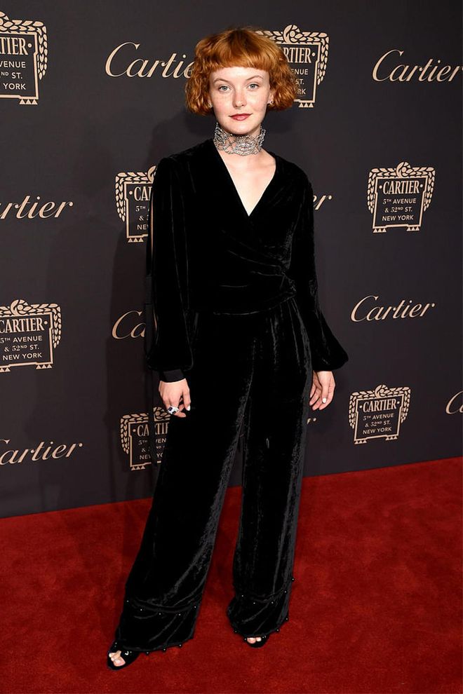 Kacy Hill looks sleek in the velvet black jumpsuit, finishing it with a jeweled choker. Photo: Getty