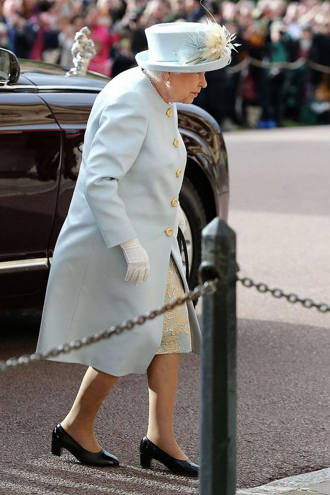 Queen Elizabeth II arriving in a powder blue ensemble.