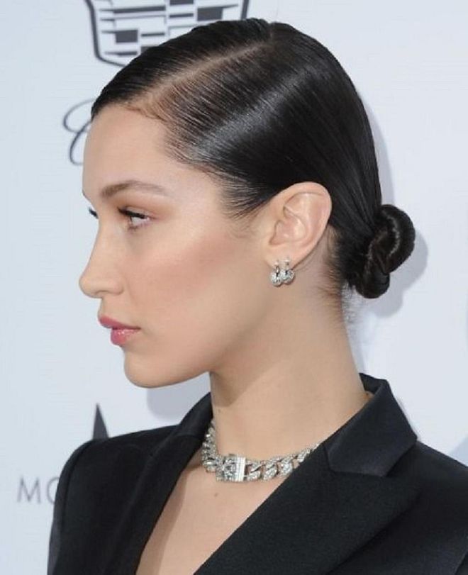 Bella Hadid's sleek bun - pulled tightly at the nape of her neck - is perfect for those who prefer an understated, no-fuss aesthetic. Photo: Getty  