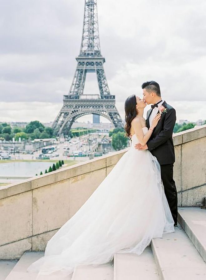 Looking toward the Eiffel Tower, the stairs of the Palais de Chaillot provide the perfect spot to snag a kiss on one couple's big wedding day.

Via Claire Morris Photography


