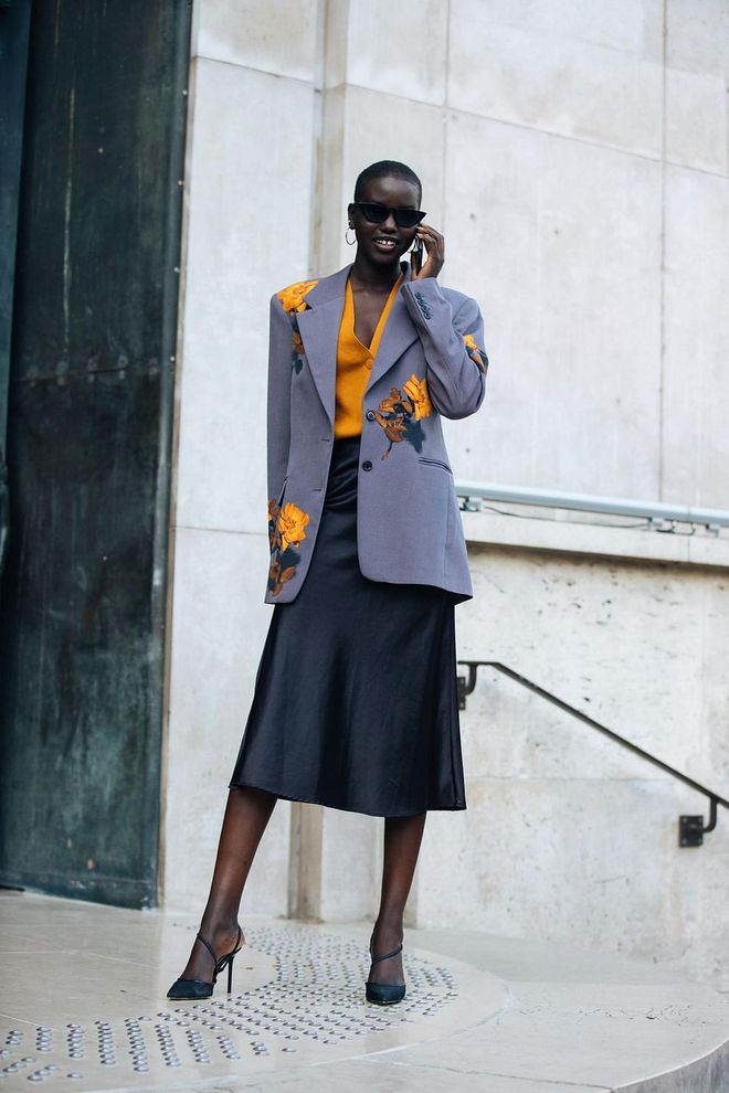 Offset an oversized blazer with a midi skirt on bottom.

Photo: Melodie Jeng / Getty