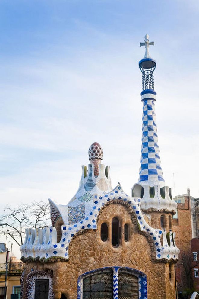 The main entrance to Park Güell on Barcelona's Carmel Hill is marked by two gingerbread-style gatehouses.