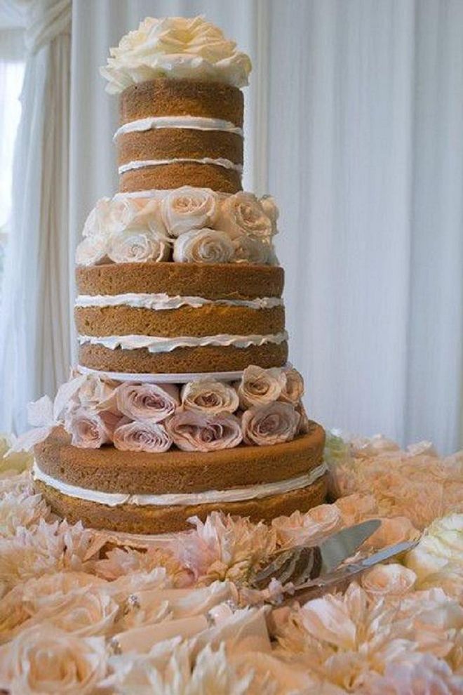Naked cakes had a moment in the wedding world, and even Duff got in on the trend, opting to go for the more simple, rustic glamour in hers to give it a "vintage homemade look." Photo: Pinterest