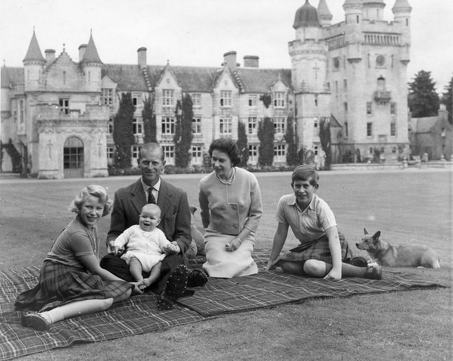 Now there's another royal sibling to play with: Prince Andrew arrived on February 19, 1960. Later that year, the royal family of five (plus the Queen's beloved corgi!) posed for a family photo at Balmoral Castle.
Photo: Getty