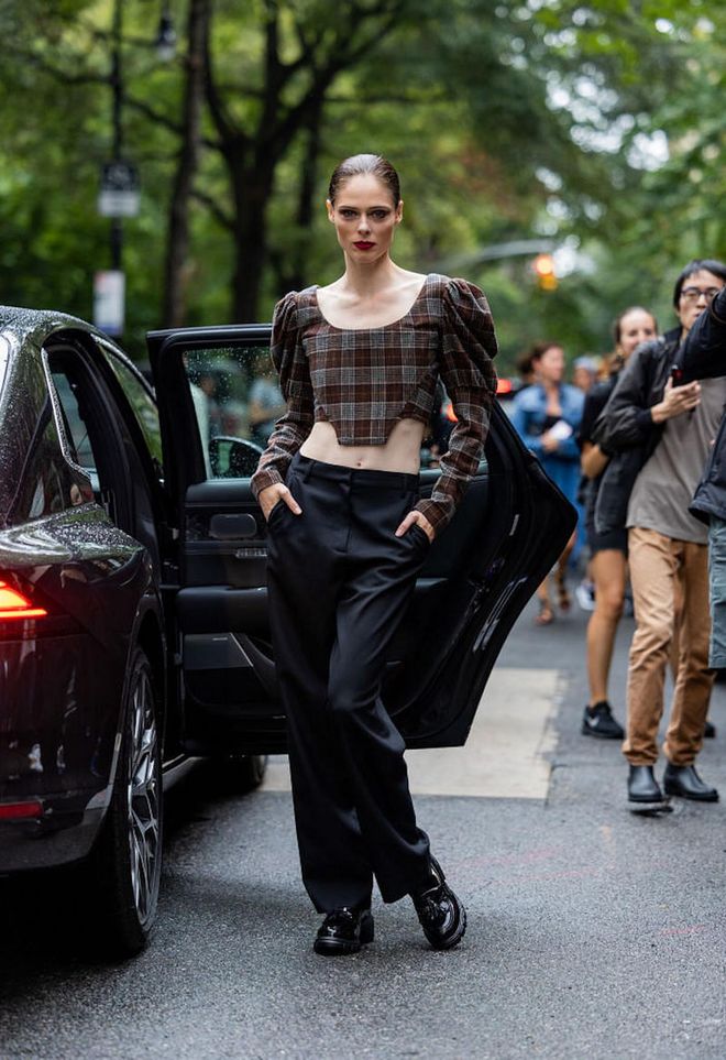 NEW YORK, NEW YORK - SEPTEMBER 11: Coco Rocha wearing checkered cropped top, black pants outside Puppets &amp; Puppets on September 11, 2022 in New York City. (Photo by Christian Vierig/Getty Images)