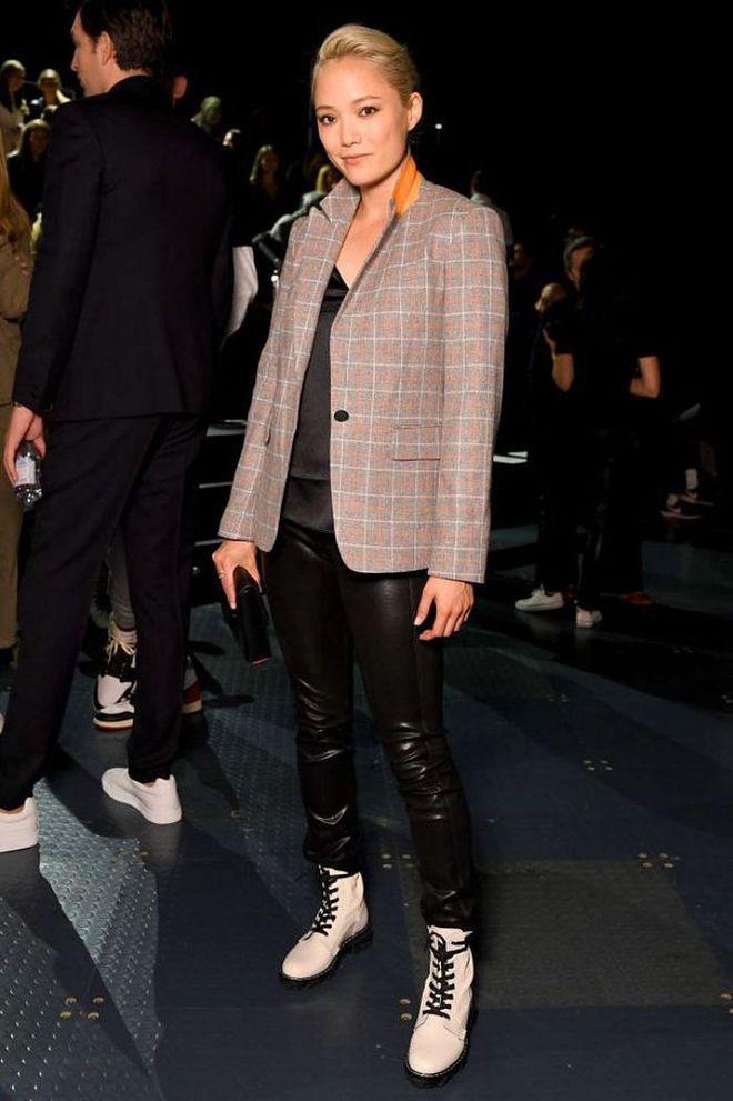 Pom Klementieff styled leather leggings and a checked blazer for the catwalk.

Photo: Albert Urso / Getty