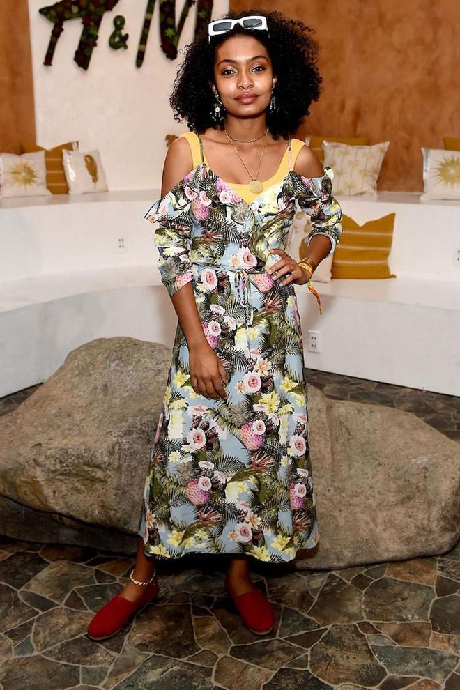 Take note from Yara Shahidi and style an off-the-shoulder dress over a bright tank top for a new take on the trend.

Photo: Getty