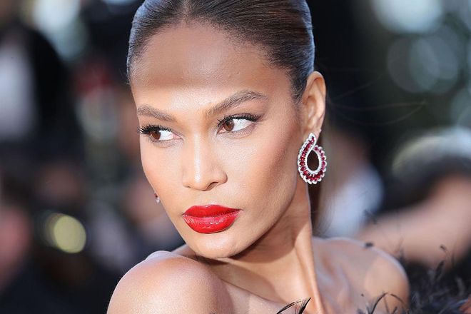While nude lips are practical for a wedding, it doesn't mean you shouldn't at least try a classic red lip (at least for a few pictures, then you can wipe it off before the big kiss). We love how Joan Smalls made a red lip look even more luxe with the addition of patent gloss.
Photo: Getty
