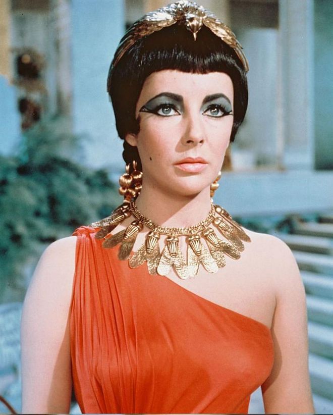 The 1963 behemoth Cleopatra had a record-breaking budget of $44 million, including almost $200,000 for Elizabeth Taylor’s costume alone.

To accompany every single one of her 65 wardrobe changes, the jeweller Joseff Of Hollywood created a treasure trove of opulent gold-plated cuffs, belts, necklaces and headdresses, imbuing the whole production with a glittering aura that still takes your breath away almost 60 years later.

And it’s not just the on-screen jewels that continue to capture our imagination. Behind the scenes, Cleopatra’s biggest stars, Richard Burton and Elizabeth Taylor, began an intense love affair that resulted in some truly lavish jewellery purchases.

Both frequented Bulgari’s flagship boutique during filming in Rome and Burton showered his lover with a host of Bulgari gems during their relationship, including an emerald engagement ring, an enormous emerald necklace (which she wore to their wedding) and a flamboyant sautoir with a 65-carat cabochon-cut sapphire pendant, bought for Taylor’s 40th birthday.

Indeed, as Burton himself once joked, “I introduced Liz to beer. She introduced me to Bulgari.”

Photo: Silver Screen Collection