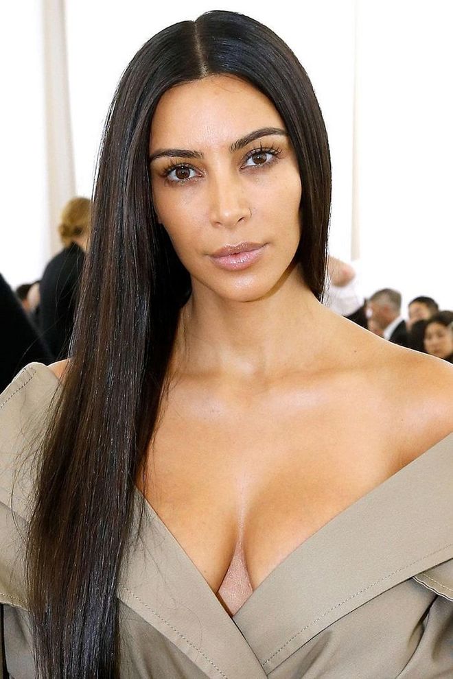 Kim Kardashian's sleek center part is strikingly dramatic all on its own - no volume or makeup required. Photo: Getty