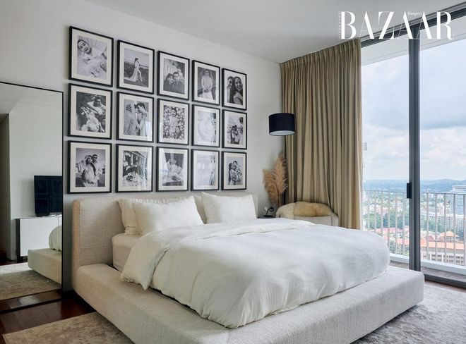 The master bedroom is a monochromatic oasis of calm overlooking the cityscape.