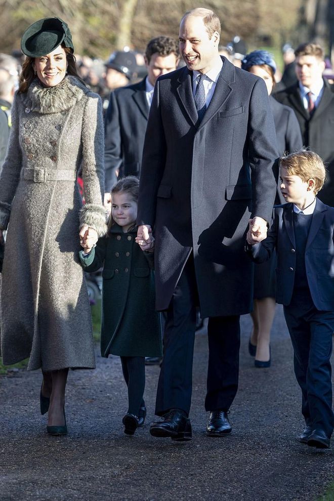 William holds George and Charlotte's hands as they attend the Christmas Day Church service at Church of St. Mary Magdalene on the Sandringham estate.

Photo: Getty