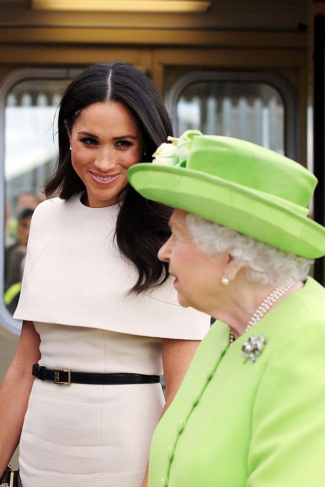 A sweet smile from Markle at the platform. Photo: Getty