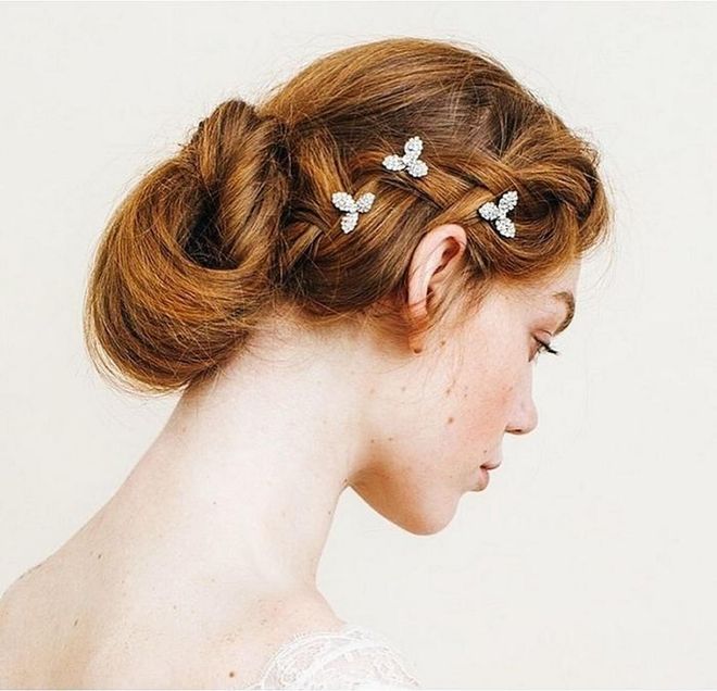 Upgrade a low bun with a side braid and sparkly pin details. Photo: @jenniferbehr