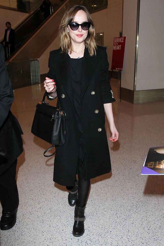 Dakota Johnson looked smart in sunglasses and a black coat.
Photo: Getty