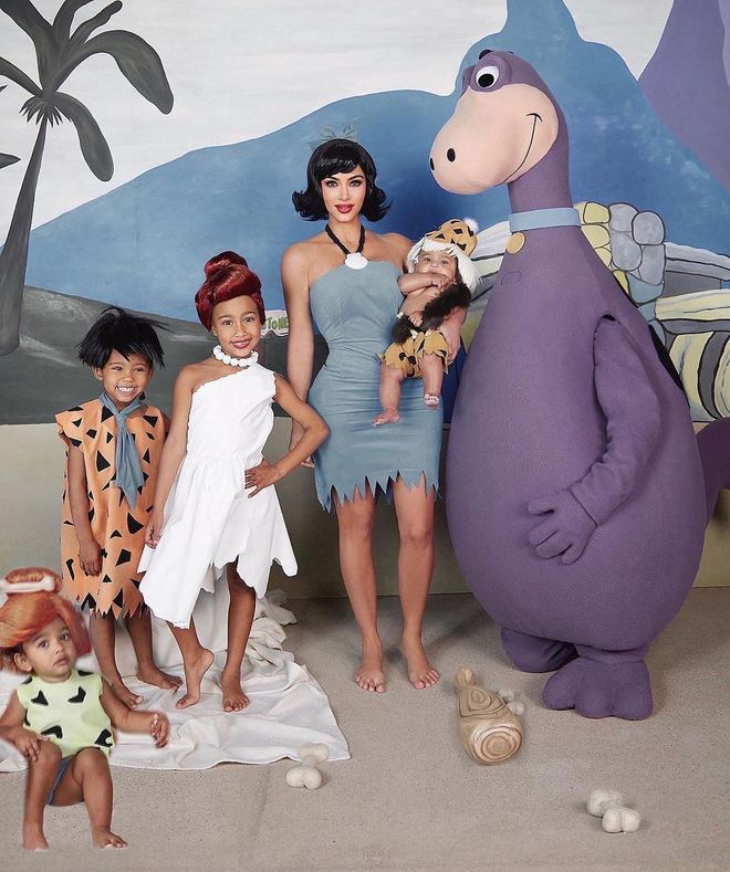 Kim and her brood dressed up as the Flintstones: the reality star was Betty Rubble, her Saint was Fred, North was Wilma, Chicago was Pebbles, and Psalm was Bamm-Bamm. And yes, Kanye was in the Dino suit.