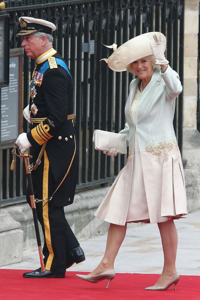 Charles and Camilla arrive at the nuptials. She is wearing an Anna Valentine ensemble, a Philip Treacy hat, and Jimmy Choo shoes. He is in Royal Navy Number One Dress.
Photo: Getty
