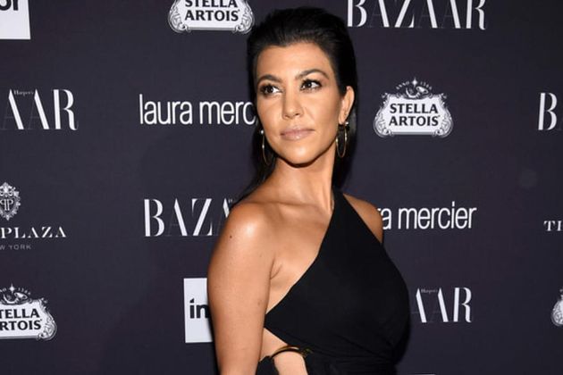 Kourtney Kardashian Paired a Cropped Leather Jacket with Waist-Cutout Trousers