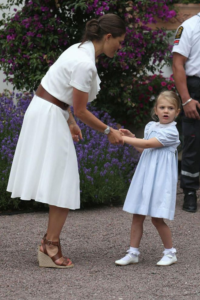 Princess Victoria is the eldest daughter of King Carl XVI Gustaf and the heir apparent to the throne. The 39-year old is pictured here with her daughter, Princess Estelle, wearing a summery dress by Ralph Lauren.