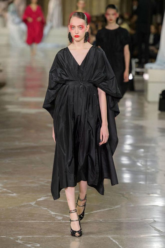 For an understated update of the spring catwalks, try some red eye make-up and a cloak-like black gown as seen at Kenzo.